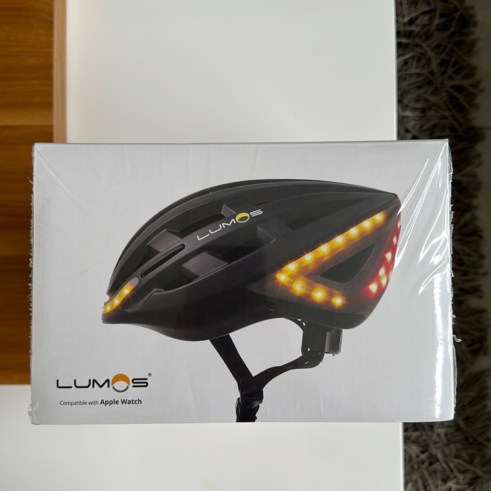Brand new and sealed Lumos kickstart helmet, it is compatible with Apple Watch.